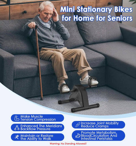 Senior man using 12 Speed Adjustable Mini Under Desk Exercise Bike with LCD Display, Quiet Bidirectional Pedals for Home Use.