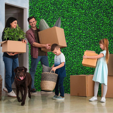 Family in room with Artificial Boxwood Roll Panels 48x120 Inches Cover 40 Sq Ft UV Resistant Faux Ivy Leaves Privacy Fence