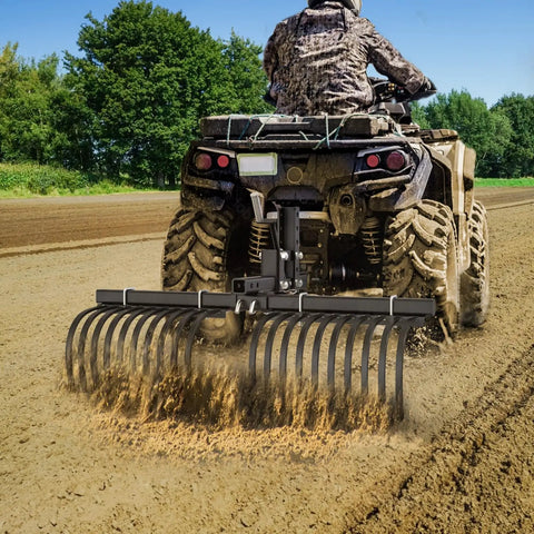 Heavy Duty ATV UTV Landscape Rake Attachment for yard cleanup and land grading in use, leveling soil with adjustable width