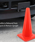 Bright Orange 18 Inch Traffic Cone Built Tough For Weather Resistance beside vehicle bumper on asphalt