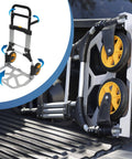 Beefy Folding Dolly With Aluminum Frame, 440 LB Capacity Hand Truck displayed folded in truck bed, rugged rubber wheels visible