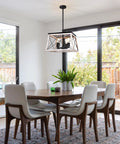 Farmhouse Chandelier For Dining Room And Kitchen Island Rustic White Wood Pendant Light Distressed Four Light Ceiling Fixture Large Hanging Ceiling Lantern For Entryway Hallway Foyer With Barn Chic Vibe That Pops In Any Room hanging above a dining table.