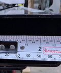 Close-up of Table Saw Fence Drawer for Biesemeyer Style Rails showing left-side dimension measurement with ruler.