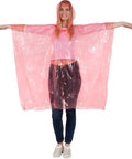 Disposable Rain Ponchos Bulk Pack For Adults And Teens, Emergency Waterproof Rain Gear in pink, female model arms outstretched