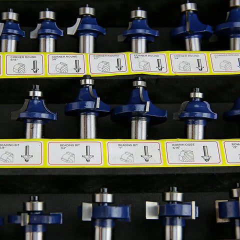 Close-up of router bits from the 80 Piece One Half Inch Shank Carbide Router Bit Set for Woodworking with labeled slots.