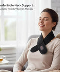 Woman relaxing with Portable Heated Neck Massager Wrap With 3 Heat Levels And 3 Vibration Modes, sitting in cozy home setting.