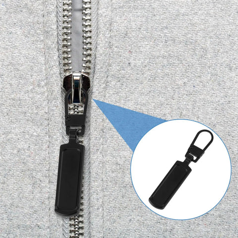 Close-up of 8 Pack Black Zipper Pull Replacements For Jackets And Coats Bags And Luggage Easy Install Zipper Sliders on gray fabric