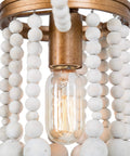 Close-up of Beaded Chandelier Farmhouse Pendant Light With Antique Gold Finish And White Wood Beads showcasing light bulb detail.