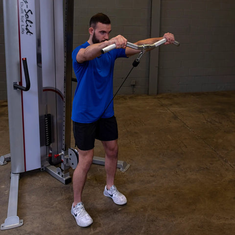 Man using Straight Up Heavy Duty Aluminum Curl Bar Attachment Compatible With Cable Machines for arm workouts in home gym.