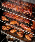 Smooth Operator Vertical Electric Smoker 1600W with eight chrome racks filled with smoked ribs, wings, and sausage.