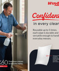 Man cleaning window with GeneralClean X60 Multi-Task Cleaning Cloths, showing durability and reusability in industrial setting.