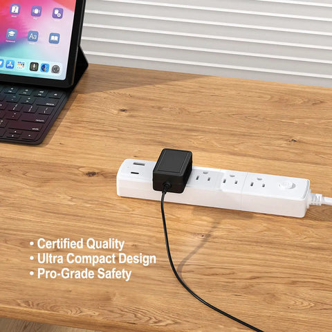 Micro USB AC/DC Charger For Approach R10 Golf Launch Monitor plugged into a power strip on a wooden table next to a tablet.