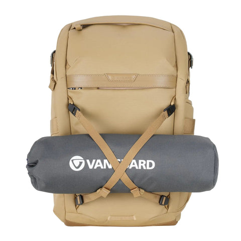 Front view of Metro B30L 30L Camera Backpack With Convertible Daypack In Beige, rolled mat attached below, travel ready for creators.