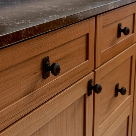 Matte Black Cabinet Knobs Set Five Pack One And One Quarter Inch Round For Dressers And Drawers Kitchen Cabinets Vanity Furniture And Closet Doors Durable Metal Hardware For Easy Weekend Update Franklin Brass installed on a wooden cabinet