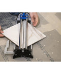 17 Inch Tile Cutter For Ceramic And Glass Mosaic Tiles, DIY Friendly Tool in use, cutting a tile with precision on a floor