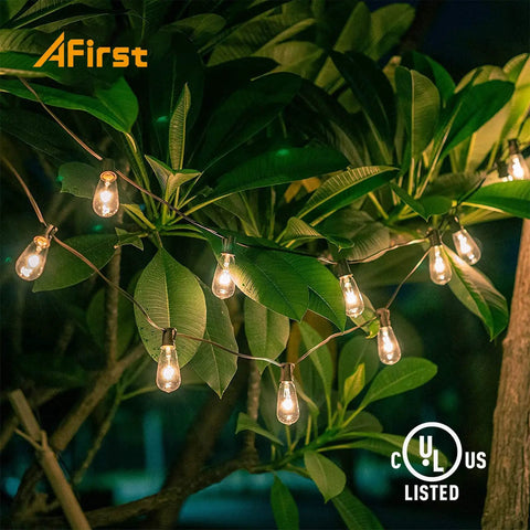Outdoor String Lights 20Ft With 22 Edison Bulbs E17 Base Vintage Warm White illuminating a garden tree at night