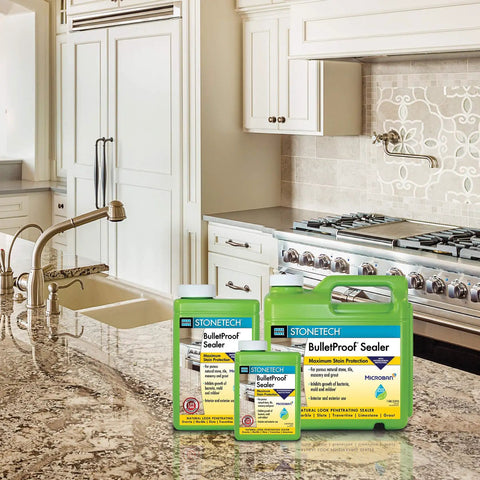Built Tough Pro Grade All Purpose Concrete Floor Sealer With Next Level Water And Oil Stain Protection Using Low Voc Water Based Formula For Smooth Durable Indoor Garage Slabs displayed on a granite kitchen countertop.