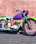 Vintage motorcycle with vibrant 12 color rim wraps, showcasing 216 Piece Spoke Skin Set For Bikes And Motorcycles, brick wall backdrop.