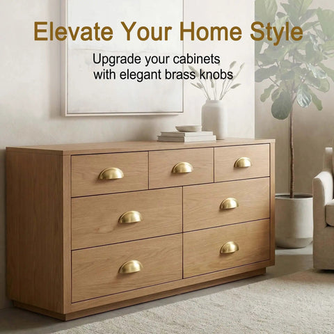 Top-Notch Solid Brass Cabinet Pulls With A Slick Brushed Gold Cup Look on wooden dresser with six drawers.