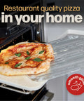 Side view of perforated metal pizza peel with pizza, inserted into an oven; Smooth Glide badge visible.