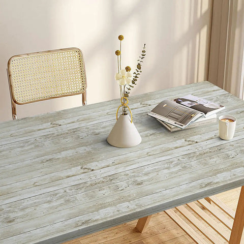 Vintage Wood Shiplap Peel And Stick Wallpaper With Realistic Grain Texture used on tabletop with chair, vase, and magazine.