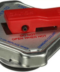Side view of Safety Release Radiator Cap With Lever Model 31534 for cars, durable metal design with caution instructions visible.