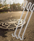 Heavy Duty Steel Manhole Hook With Ergonomic Grip No Sweat Lift For Opening Septic Tank Riser And Storm Drain Cover Fast On Any Worksite Daily Safely with city street manhole