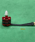 Buttery Smooth A2212 Brushless Motor Set 920KV showing motor with pre-soldered wires for drone builds on green surface.