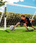 Child playing soccer with 6x4 Ft Kids Soccer Goal For Backyard Fun With Lightning Fast Setup Unbreakable Frame And Easy Two Minute Assembly