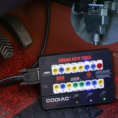 Auto ECU Breakout Box GT100 OBDII Protocol Detector attached under car dashboard for diagnostic use
