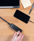 3 Outlet Power Strip Surge Protector With 15 Ft Braided Cord, Flat Plug, 250 Joules, UL Listed, Black, powering devices on desk.