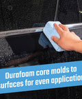 Hand using Pro Grade Microfiber Applicator Pads 2 Pack With Ultra Soft Foam Core For Easy Wax Sealant Dressing on black car door
