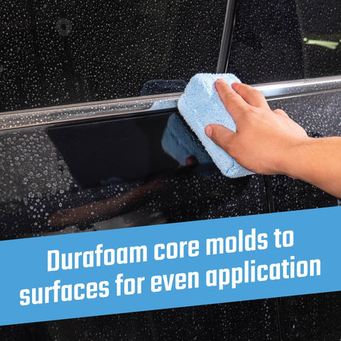 Hand using Pro Grade Microfiber Applicator Pads 2 Pack With Ultra Soft Foam Core For Easy Wax Sealant Dressing on black car door