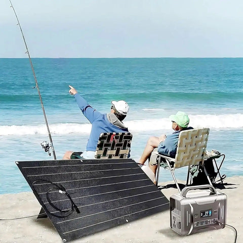 1200W Solar Panel Kit With Two 600W Flexible Monocrystalline Panels And Built In Charge Controller For 12 To 48V Battery Charging Campers And Off Grid RV Power Solutions on a beach with two people fishing.