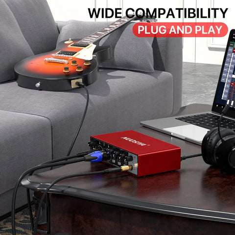 Red USB Audio Interface For PC And Mac, Pro Grade Studio Sound 24 Bit 192 KHz, Real Time Monitoring shown connected to guitar