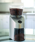 Top Shelf Conical Burr Coffee Grinder Featuring Commercial Steel Burrs with beans and ground coffee visible