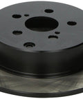 Rear brake rotor; angled top view showing black hub and brushed steel rotor disk