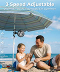 Rechargeable Battery Operated Stroller Fan Clip On for Baby shown attached to beach umbrella with family enjoying on sand