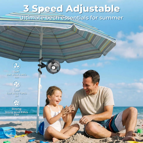Rechargeable Battery Operated Stroller Fan Clip On for Baby shown attached to beach umbrella with family enjoying on sand