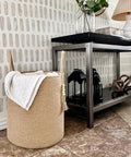 Tall Woven Laundry Basket for Living Room and Bedroom, Boho Farmhouse Round Wicker Blanket Basket near console table.