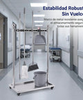 Go-To Floor Standing Mop And Broom Storage Rack For Schools, Factories, And Maintenance Crews - Heavy-Duty Cleaning Tool Holder, Movable Organizer, Keeps Cleaning Supplies Neat, Accessible, Ready To Use. stainless steel mop and broom rack on wheels in hospital hallway