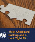 Two puzzle pieces from the 300 Piece Hot Air Balloon Festival Puzzle For Adults By Michael David Ward on a wooden table