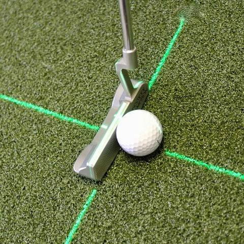 Solid Side Laser Putting Trainer For Righty Golfers Groove Plus Alignment Tool on green turf with golf ball and laser line.