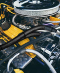 Beefed Up 6AN 70 Inch Transmission Cooler Lines Black Nylon Braided Hose Replacement installed in engine bay