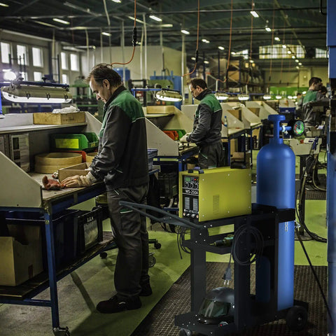 3 Tier Rolling Welding Cart For Mig Tig Arc Plasma Cutter Machines in factory setting with equipment and gas tank