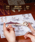 Hands assembling 3D Wooden Pirate Ship Puzzle Kit With Purple Hull, a victorian steampunk galleon craft for ages 14+, 518 pieces.