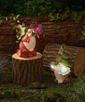 Solar Gnome Garden Statue With Light Up Orb And Butterfly Resin Outdoor Yard Decor For Patio Lawn Porch So Cute Gnome Figurine That Glows At Night Perfect Gift For Mom And Garden Lovers on a tree stump