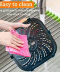 Hands cleaning Upgraded Heavy Duty 8QT Air Fryer Grill Plate With Killer Nonstick Coating in sink, carbon steel, 9.6x9.5in.