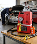 Electric Hydraulic Pump Power Pack 750W 10000 PSI 120V on a workbench in auto shop with car and mechanic in background.