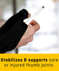 Person wearing Deluxe Thumb Stabilizer For Strong, Comfy On The Go Support, holding a smartphone, showcasing ergonomic fit.